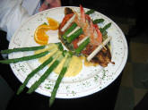 blackened fish with asparagus, hearts of palm, grilled tomateos, spinach and shrimp at a florida bed and breakfast.